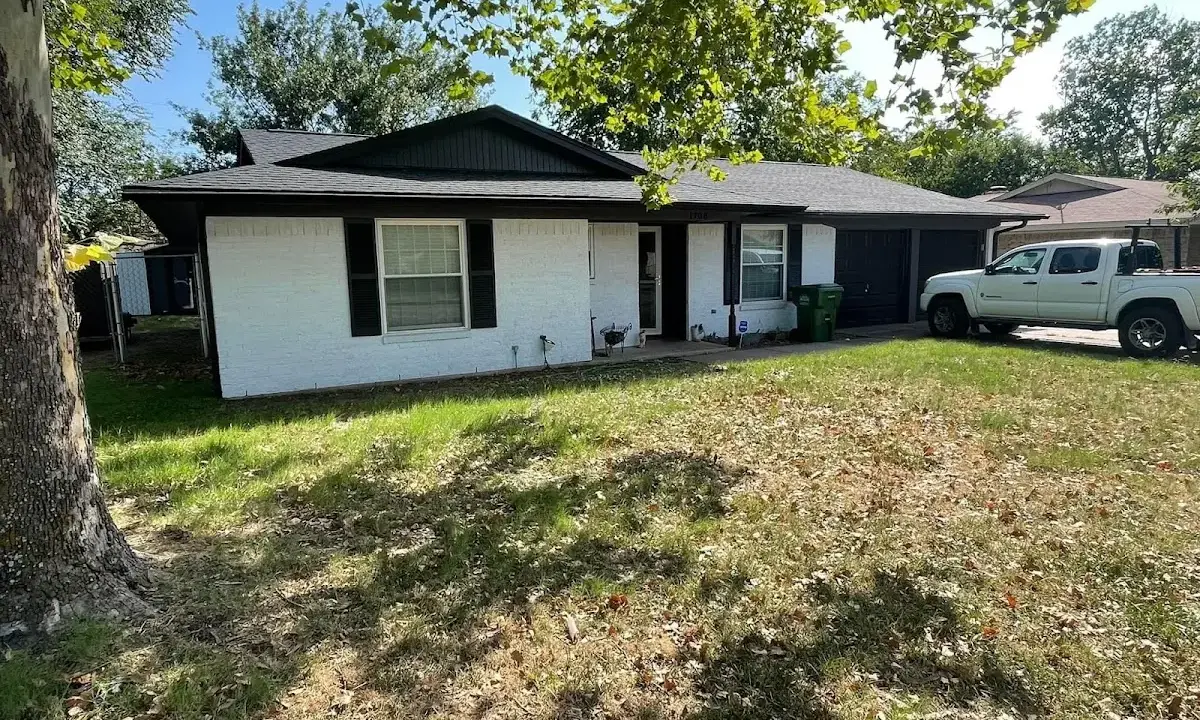 Professional roofing crew working on a residential roof in Vancouver